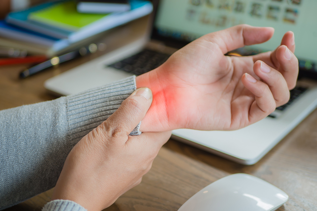 A woman showing her painful wrist